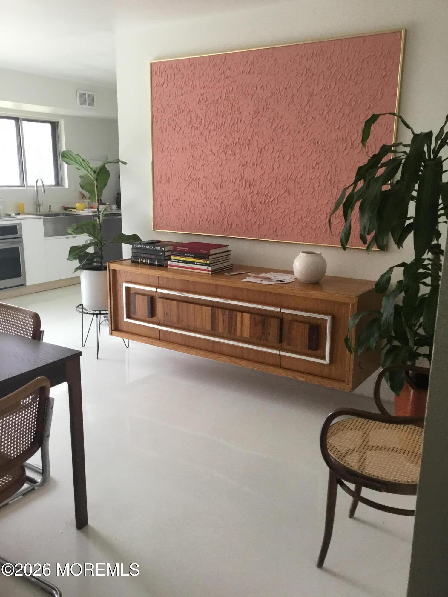 18 Liverpool Court Jackson, NJ 08527 - Photo 6 of 16 a room with furniture and a potted plant