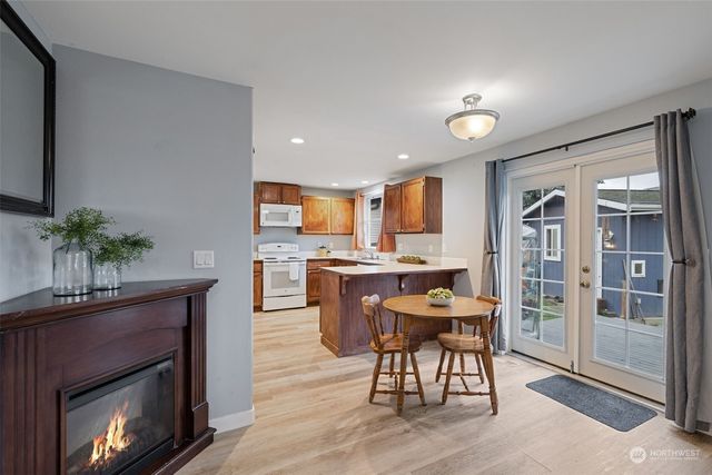 a view of a dining room with furniture window and wooden floor