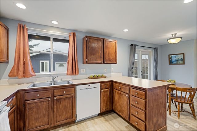 a kitchen with a sink and cabinets