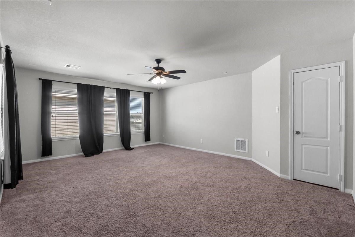 5111 Bay Lane Bacliff, TX 77518 - Photo 27 of 48 a view of an empty room with chandelier and window
