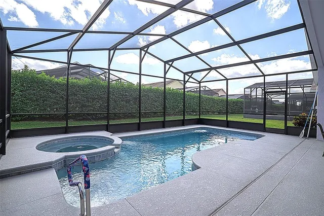 a view of swimming pool with a patio