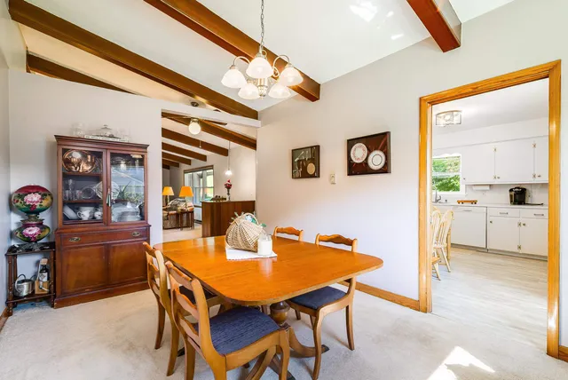 a view of a chairs and table on the wooden deck