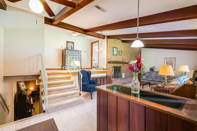 a view of a dining room with furniture and a livingroom