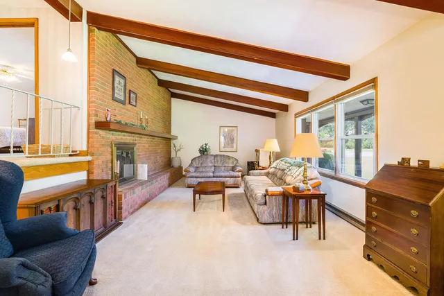 a bedroom with two beds and a window