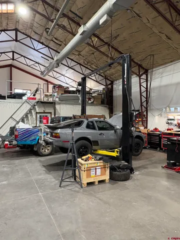 a view of parking garage with cars