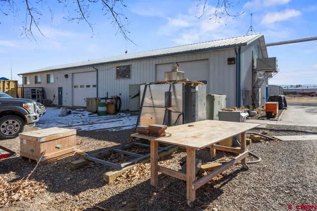 a patio with a table and chairs