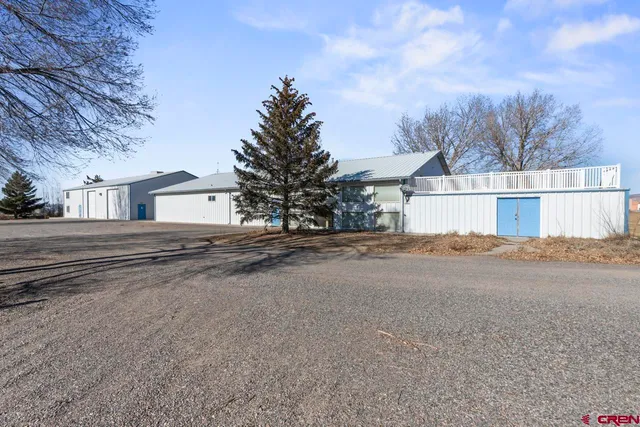 a view of a house with a road