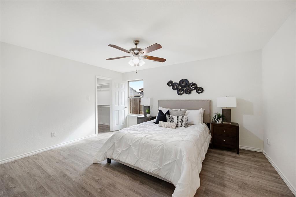 1605 Village Park Trail Burleson, TX 76028 - Photo 14 of 29 Primary Bedroom featuring a spacious closet, light wood finished floors, and ceiling fan