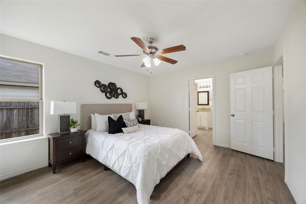 1605 Village Park Trail Burleson, TX 76028 - Photo 16 of 29 Bedroom with light wood-style flooring, ceiling fan, and connected bathroom