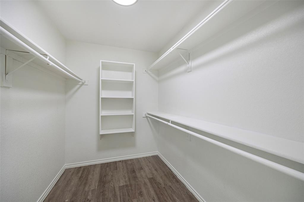 1605 Village Park Trail Burleson, TX 76028 - Photo 17 of 29 Walk in closet in primary with dark wood-style floors