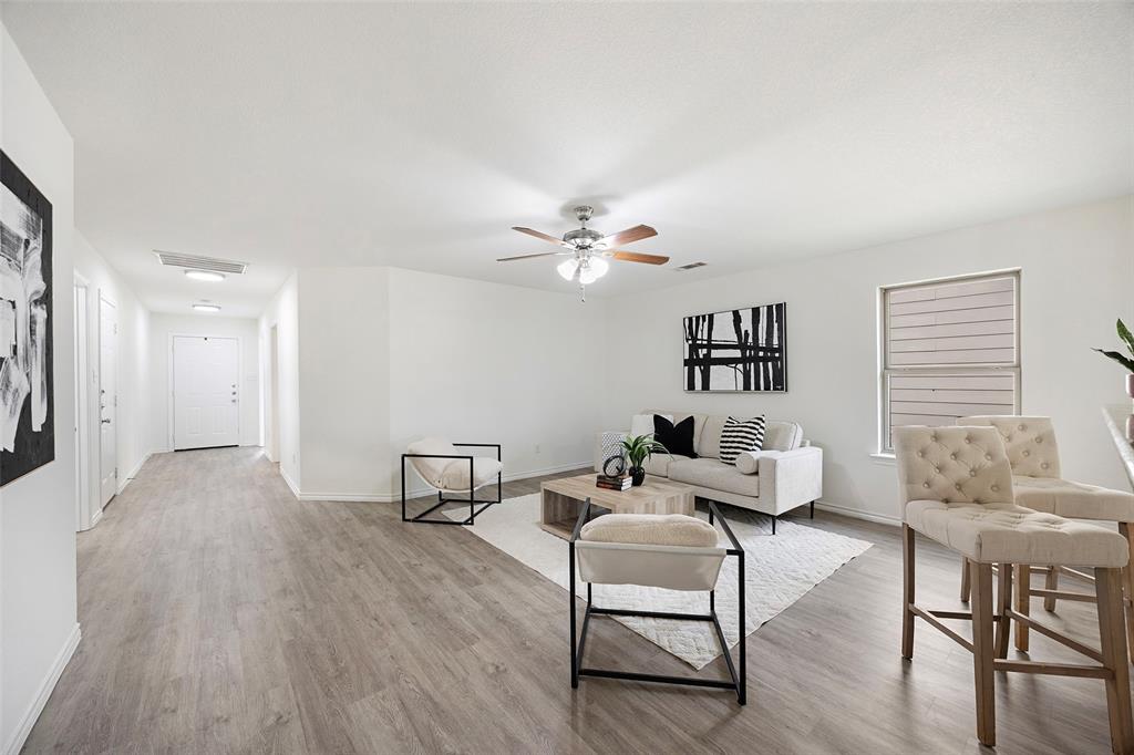 1605 Village Park Trail Burleson, TX 76028 - Photo 5 of 29 Living area with light wood-style floors and a ceiling fan