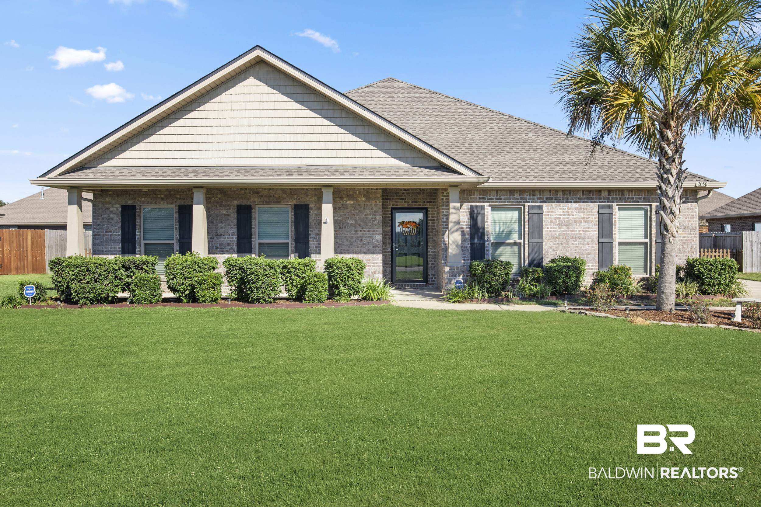 2050 Bourbon Street Foley, AL 36535 - Photo 1 of 32 View of front facade with a front yard