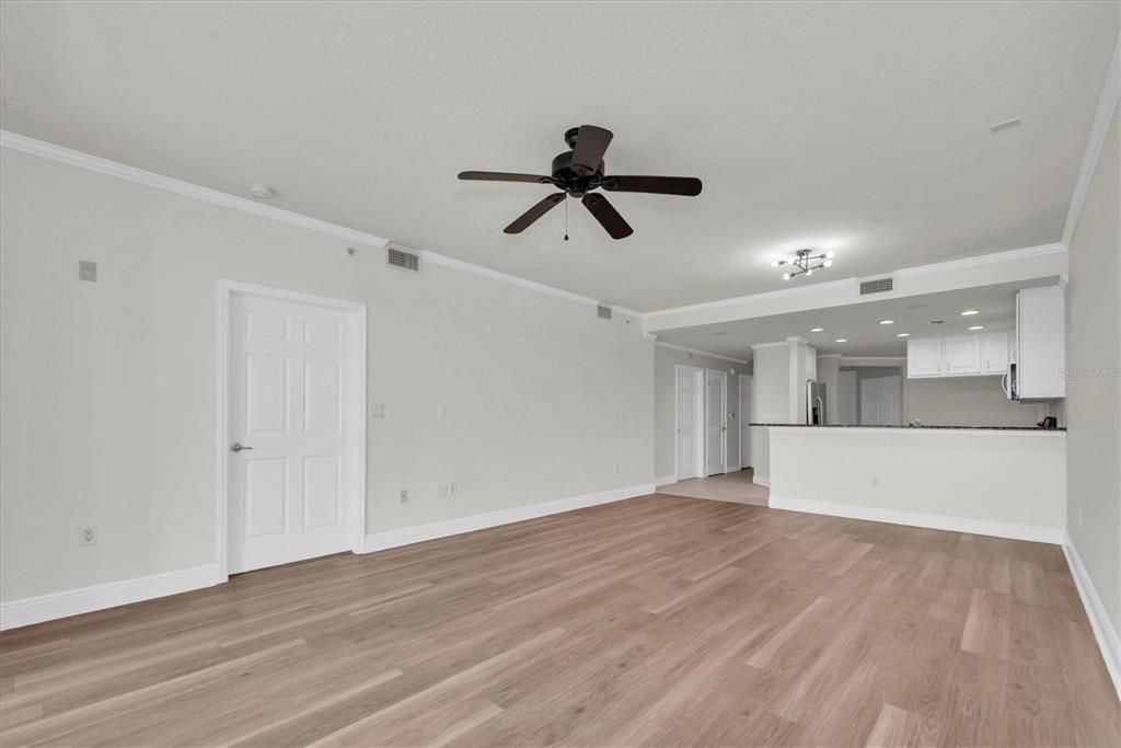 7069 Key Haven Road, Unit 302 Seminole, FL 33777 - Photo 17 of 65 a view of a room with wooden floor and windows