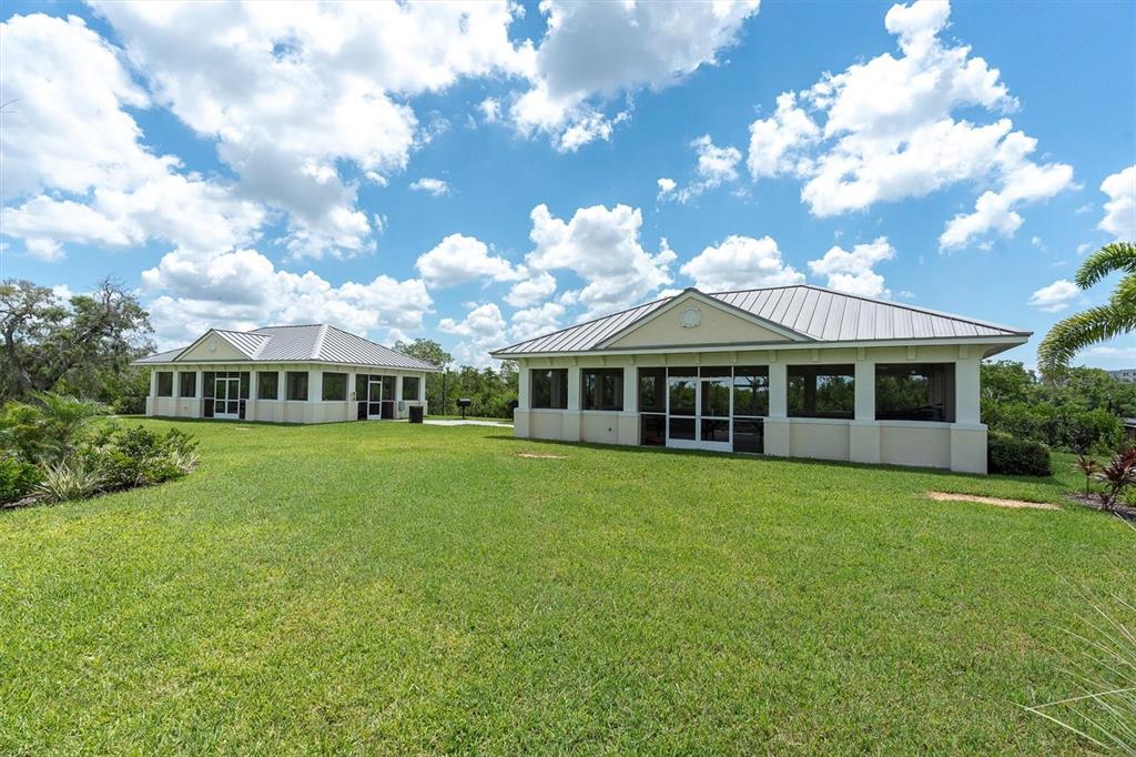 7069 Key Haven Road, Unit 302 Seminole, FL 33777 - Photo 54 of 65 a front view of a house with garden