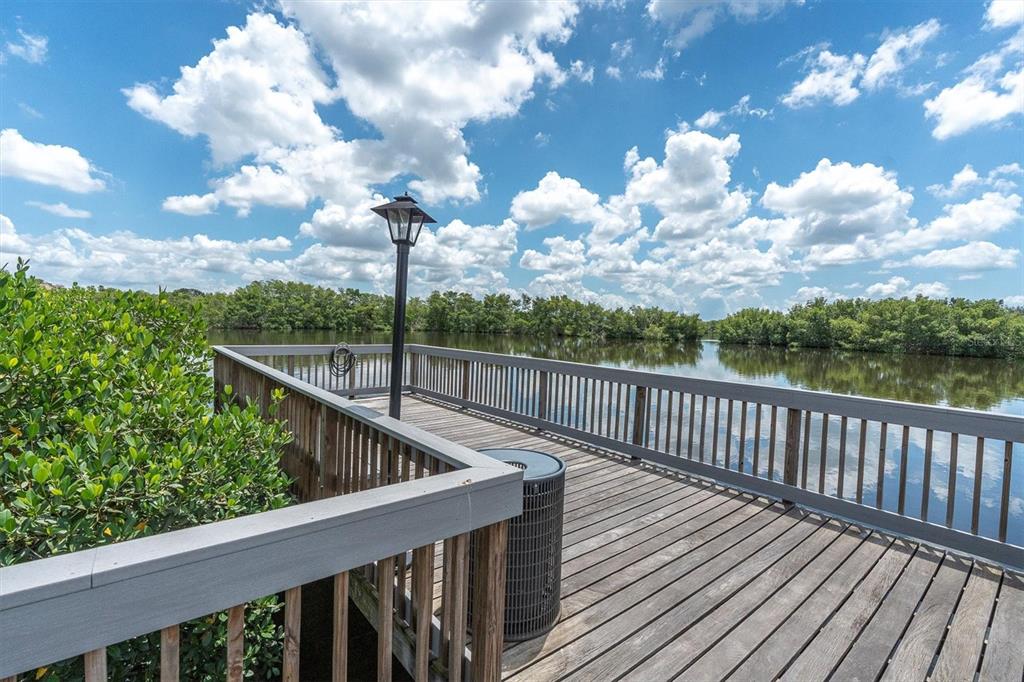 7069 Key Haven Road, Unit 302 Seminole, FL 33777 - Photo 60 of 65 a view of a balcony with wooden floor