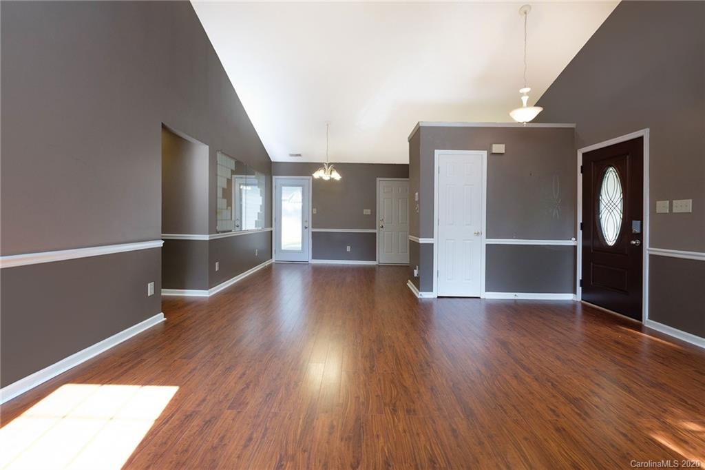 710 Foxborough Road Charlotte, NC 28213 - Photo 2 of 17 a view of a big room with wooden floor and windows