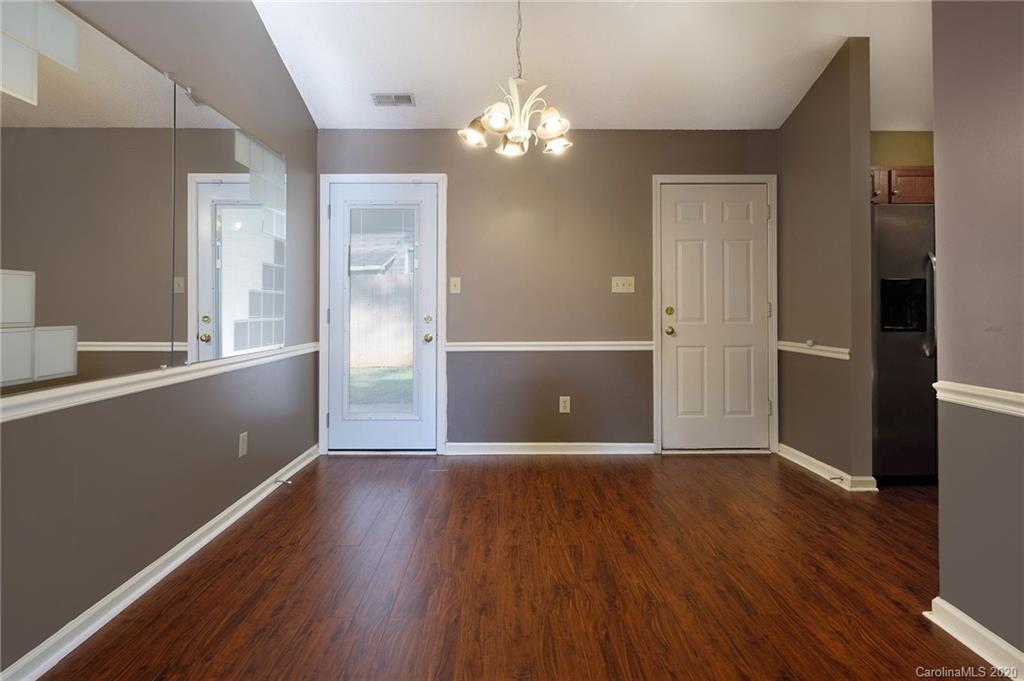 710 Foxborough Road Charlotte, NC 28213 - Photo 8 of 17 wooden floor and windows in an empty room