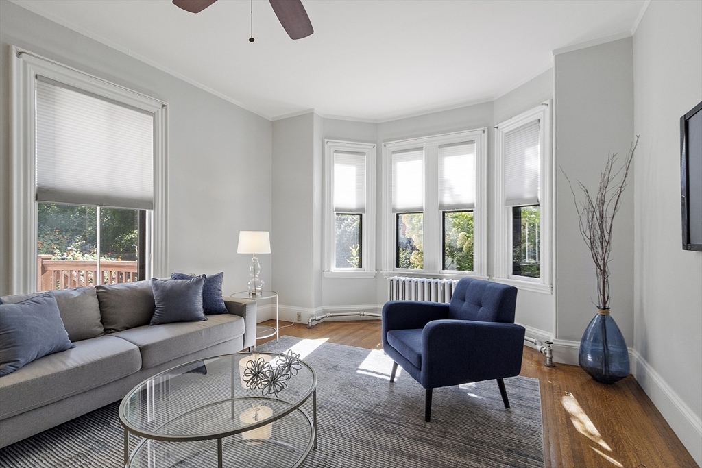 34 Day Street Somerville, MA 02144 - Photo 15 of 42 a living room with furniture and a large window