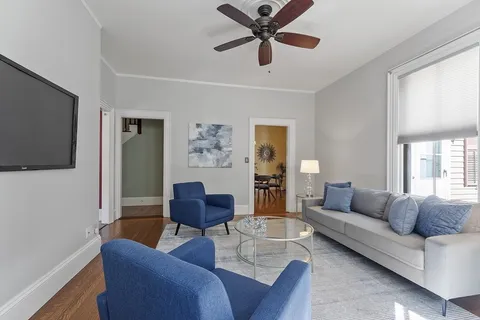 a living room with furniture and a window
