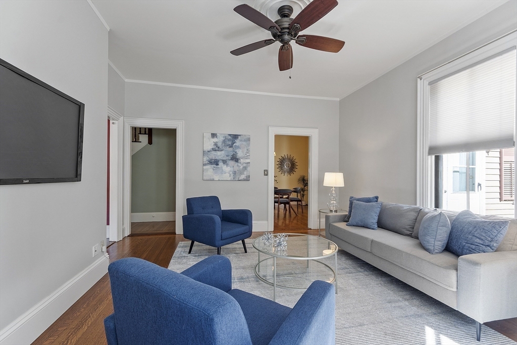 34 Day Street Somerville, MA 02144 - Photo 16 of 42 a living room with furniture and a window