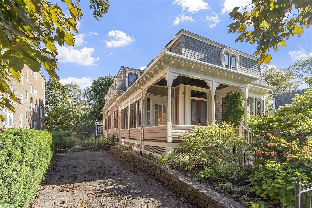 34 Day Street Somerville, MA 02144 - Photo 2 of 42 a front view of a house with garden