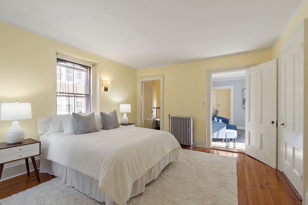 34 Day Street Somerville, MA 02144 - Photo 23 of 42 a bedroom with a bed and a couch