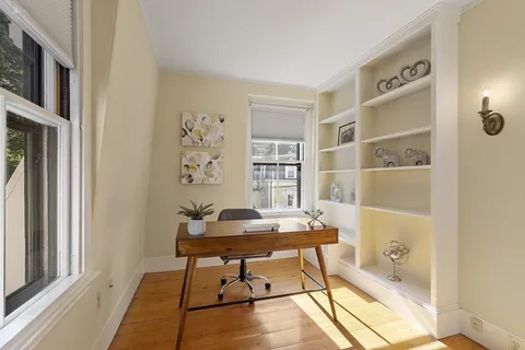 a workspace with furniture and window