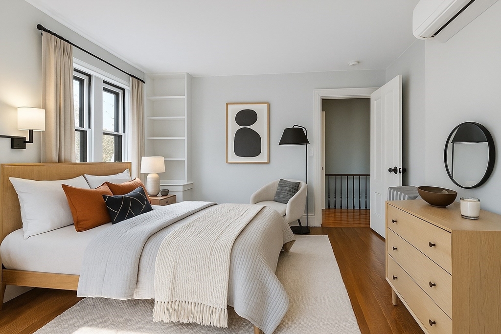 34 Day Street Somerville, MA 02144 - Photo 32 of 42 a bedroom with bed and a window