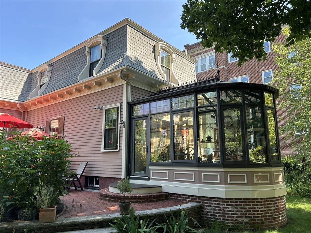 34 Day Street Somerville, MA 02144 - Photo 36 of 42 a view of a house with a yard and sitting area