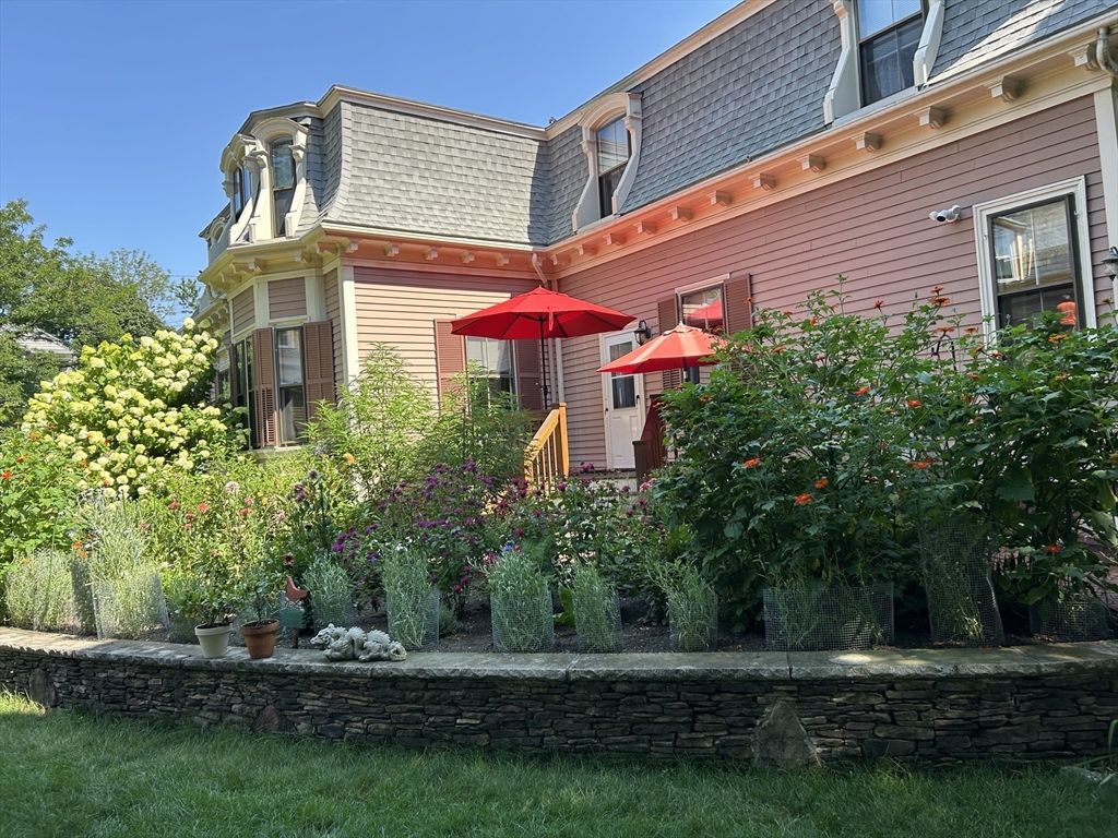 34 Day Street Somerville, MA 02144 - Photo 38 of 42 a front view of a house with a yard