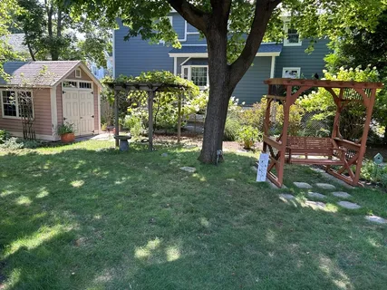 a view of a house with a backyard