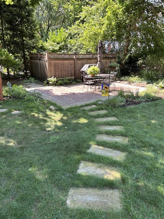 34 Day Street Somerville, MA 02144 - Photo 40 of 42 a view of a bench in a yard