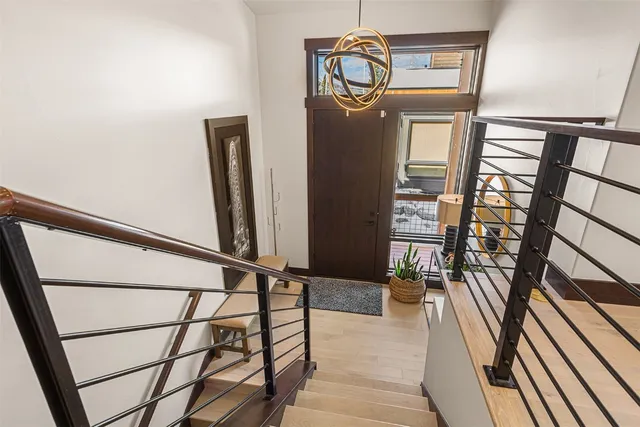 a room with wooden floor and windows