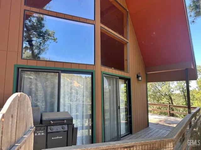 a view of a balcony with furniture