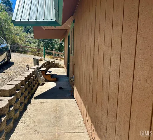 a view of hallway with furniture and a window