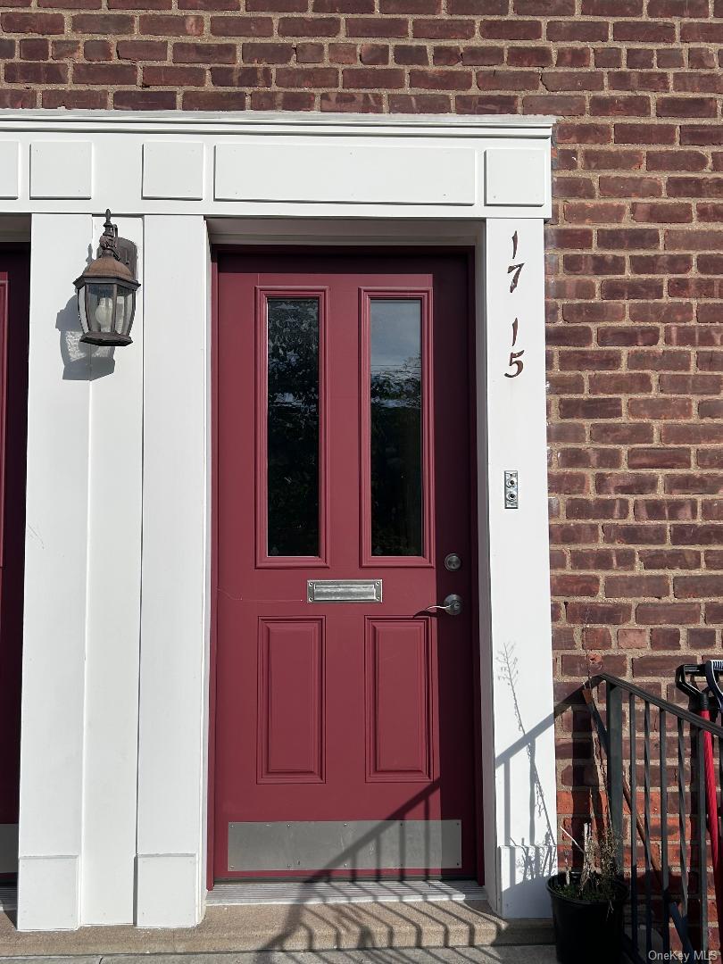 17-15 160th Street, Unit 594 Queens, NY 11357 - Photo 1 of 24 a view of front door of house and car parked