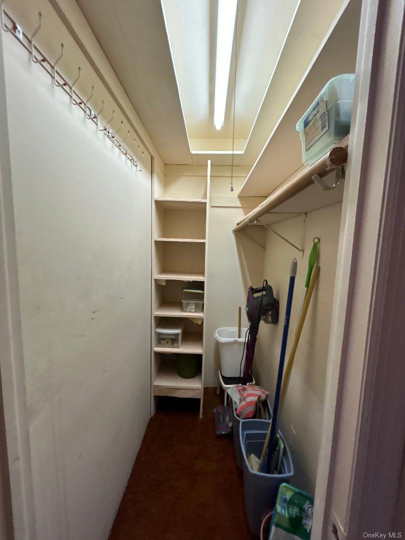 17-15 160th Street, Unit 594 Queens, NY 11357 - Photo 13 of 24 a view of a room with stairs and furniture