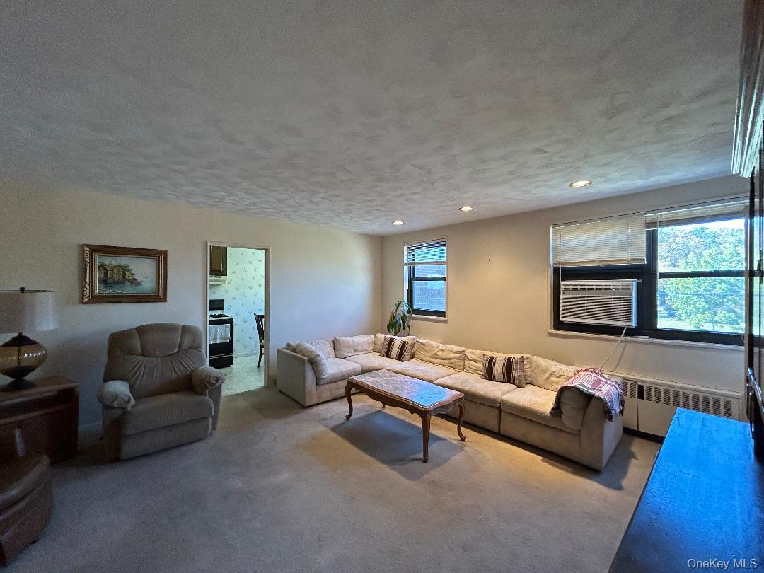 17-15 160th Street, Unit 594 Queens, NY 11357 - Photo 23 of 24 a living room with furniture and a flat screen tv