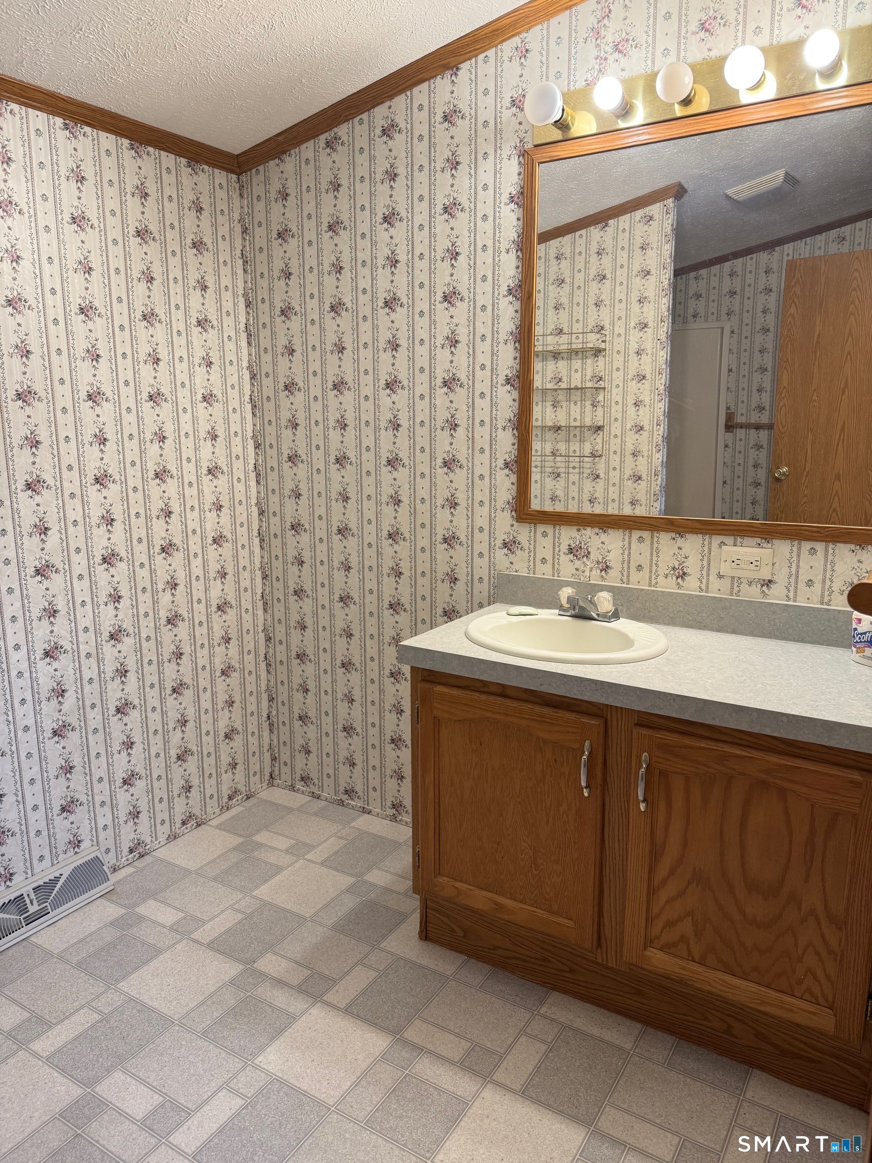 4 Maple Road Southington, CT 06489 - Photo 15 of 26 a bathroom with a sink and a mirror