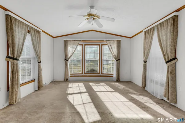 a view of a hallway with windows
