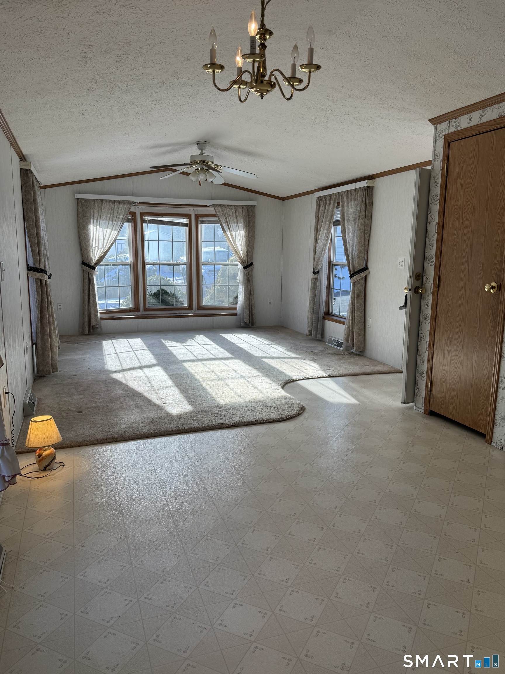 4 Maple Road Southington, CT 06489 - Photo 9 of 26 en empty room with windows and ceiling fan