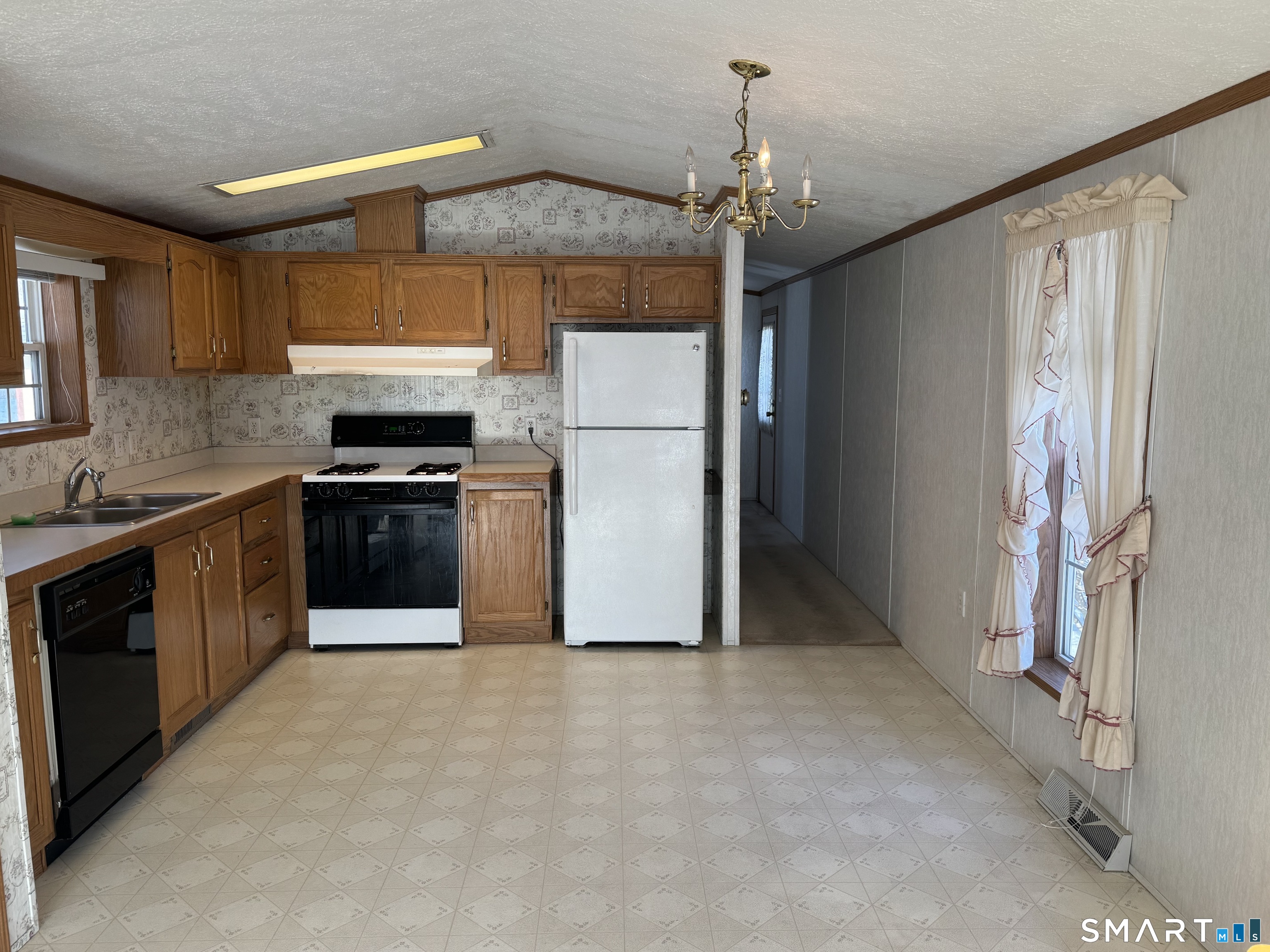 4 Maple Road Southington, CT 06489 - Photo 10 of 26 a kitchen with stainless steel appliances granite countertop a stove a refrigerator and a sink