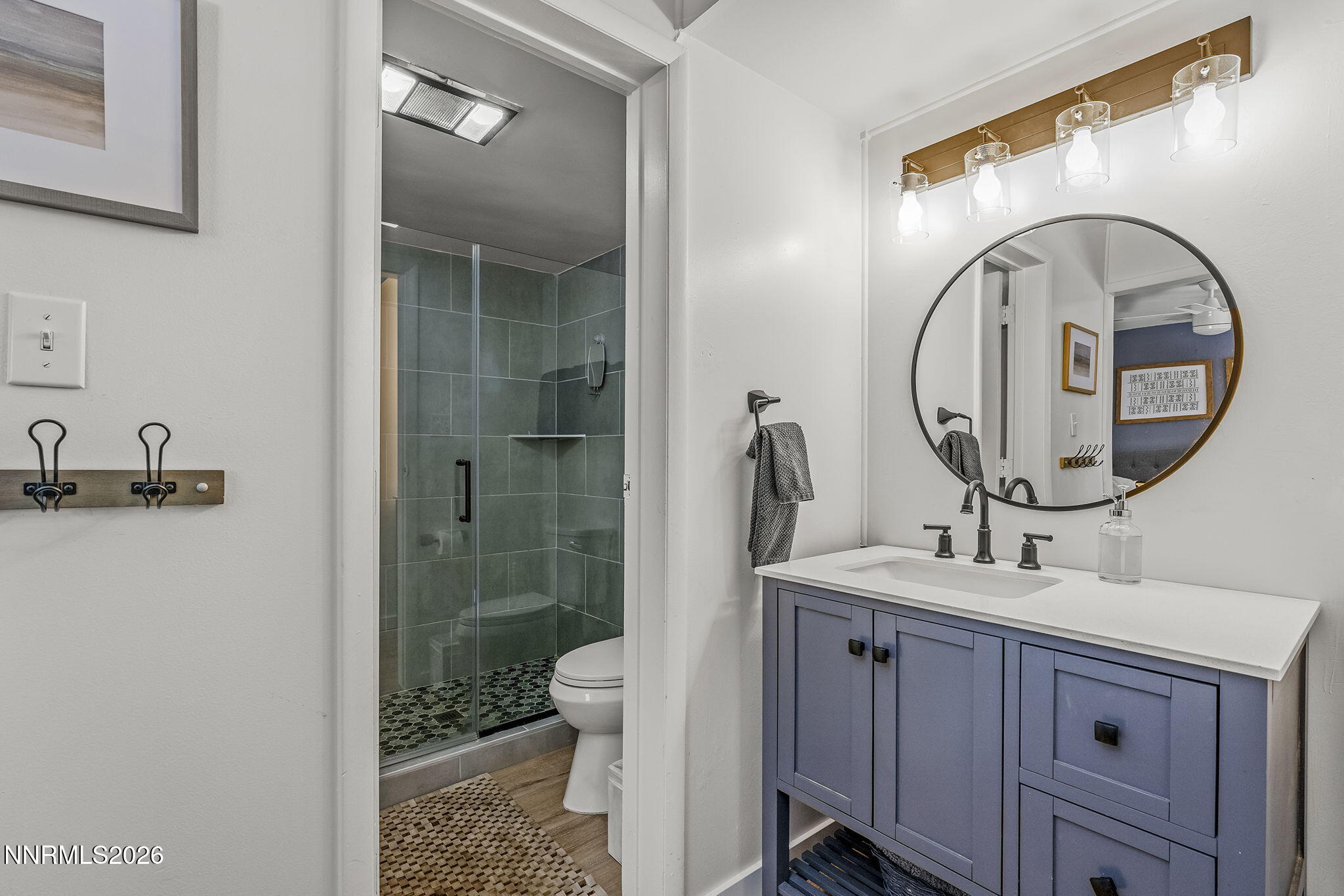 321 Ski Way Incline Village, NV 89451 - Photo 12 of 17 a bathroom with a toilet a sink and a mirror