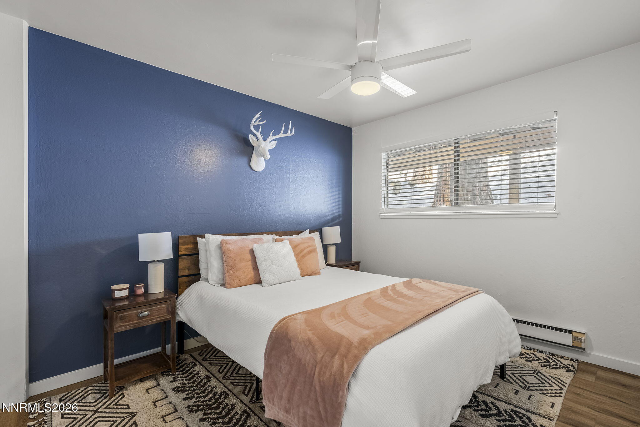 321 Ski Way Incline Village, NV 89451 - Photo 13 of 17 a bedroom with a large bed and a chandelier