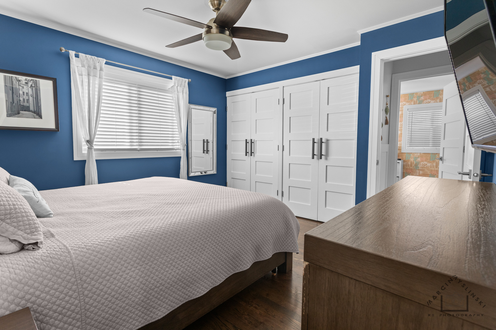 575 Olive Street Hoffman Estates, IL 60169 - Photo 15 of 26 a bedroom with a bed and a chandelier