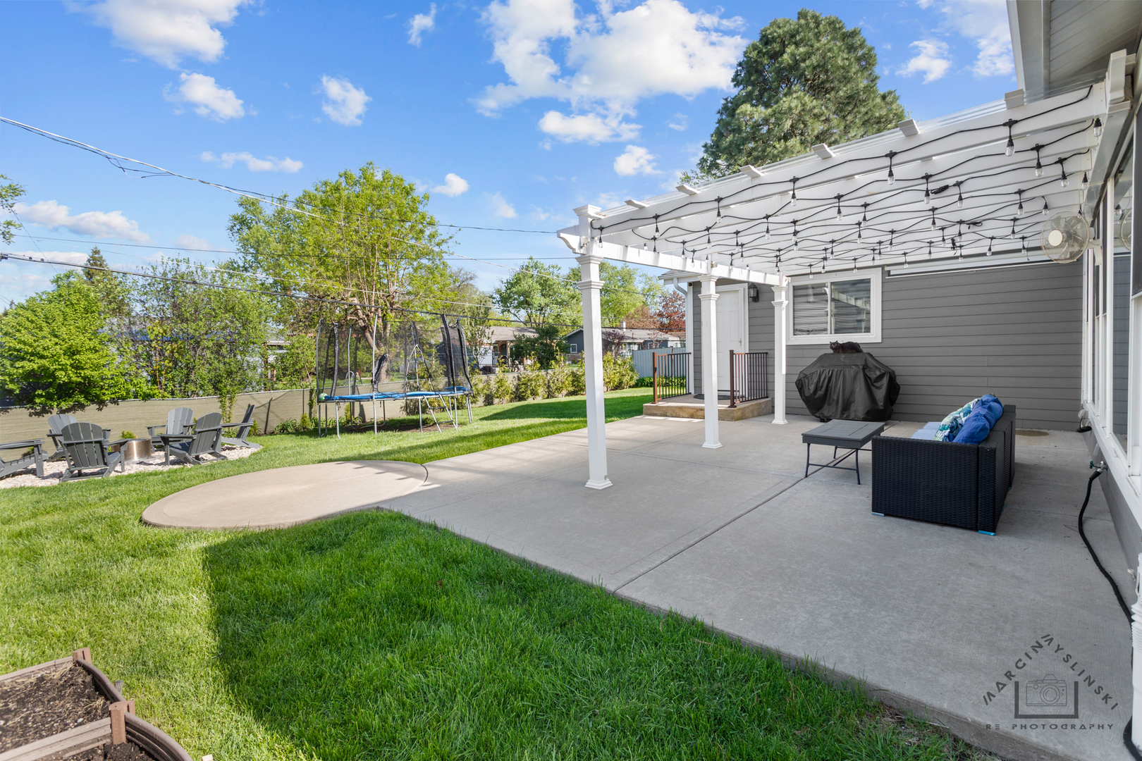 575 Olive Street Hoffman Estates, IL 60169 - Photo 25 of 26 a view of a backyard with sitting area and furniture