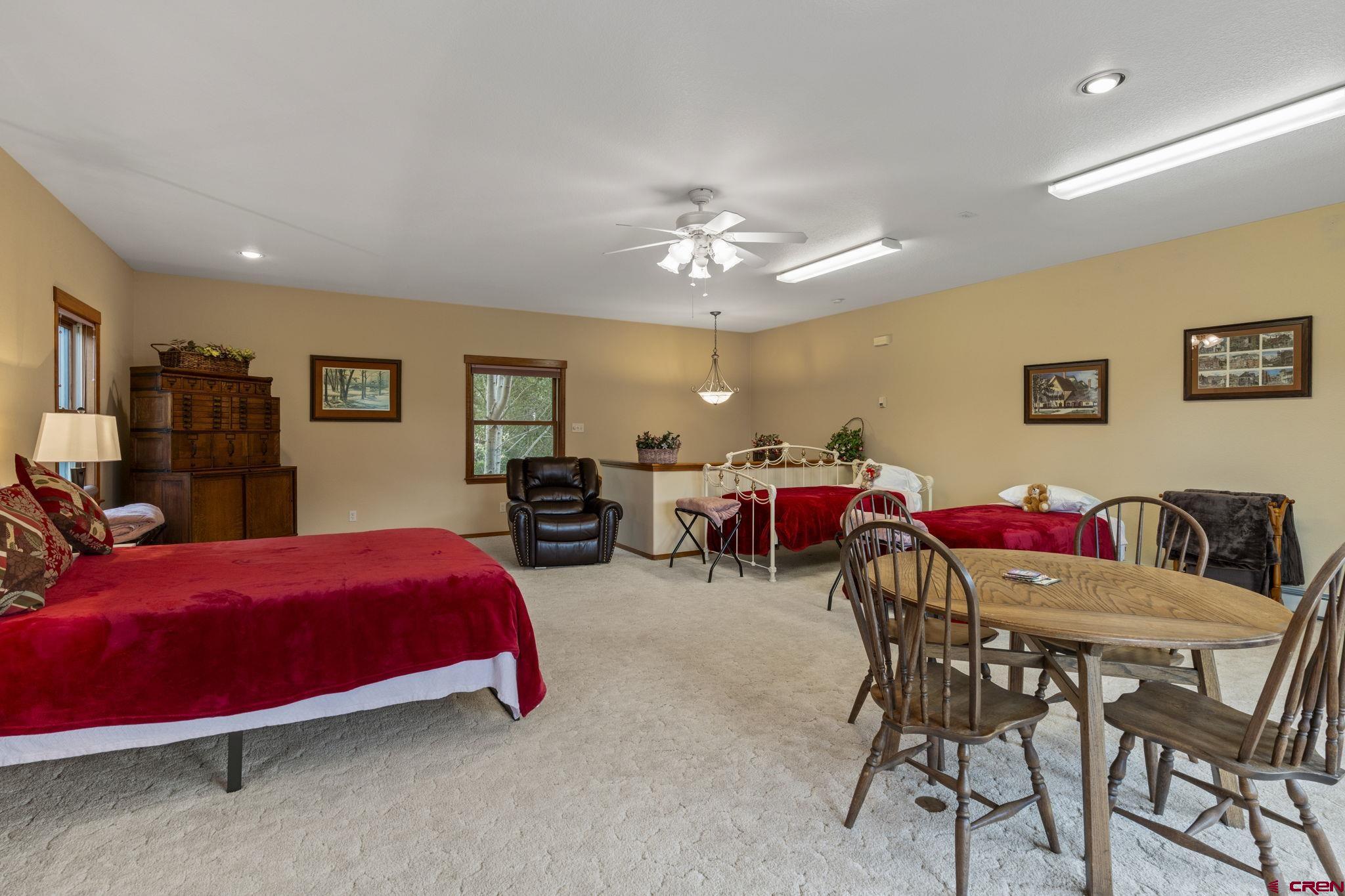 33140 Highway 550 Durango, CO 81301 - Photo 28 of 38 a bedroom with furniture and a ceiling fan