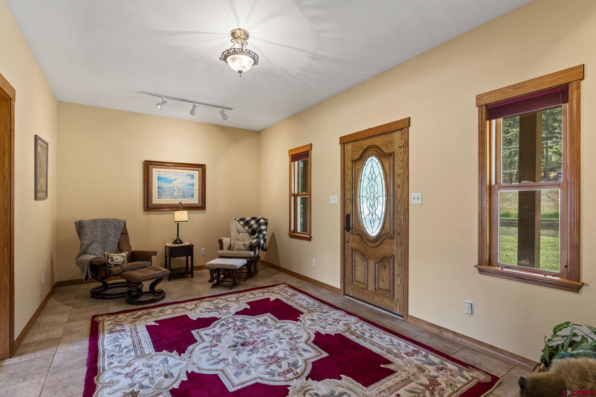 33140 Highway 550 Durango, CO 81301 - Photo 31 of 38 a living room with furniture rug and window