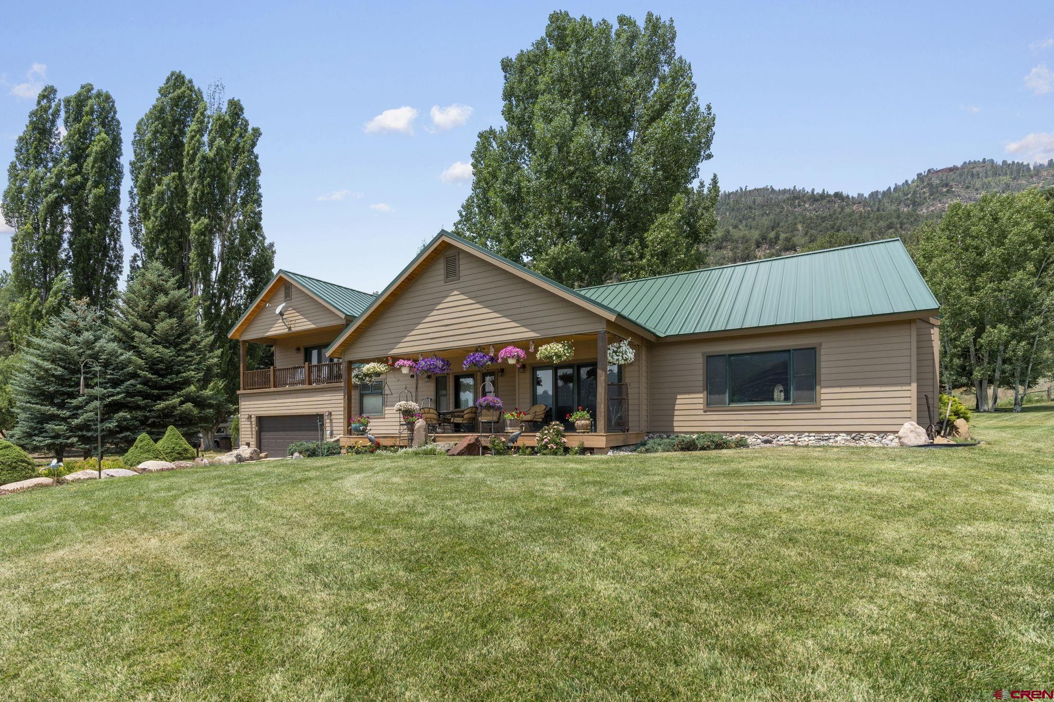 33140 Highway 550 Durango, CO 81301 - Photo 34 of 38 a front view of a house with a yard
