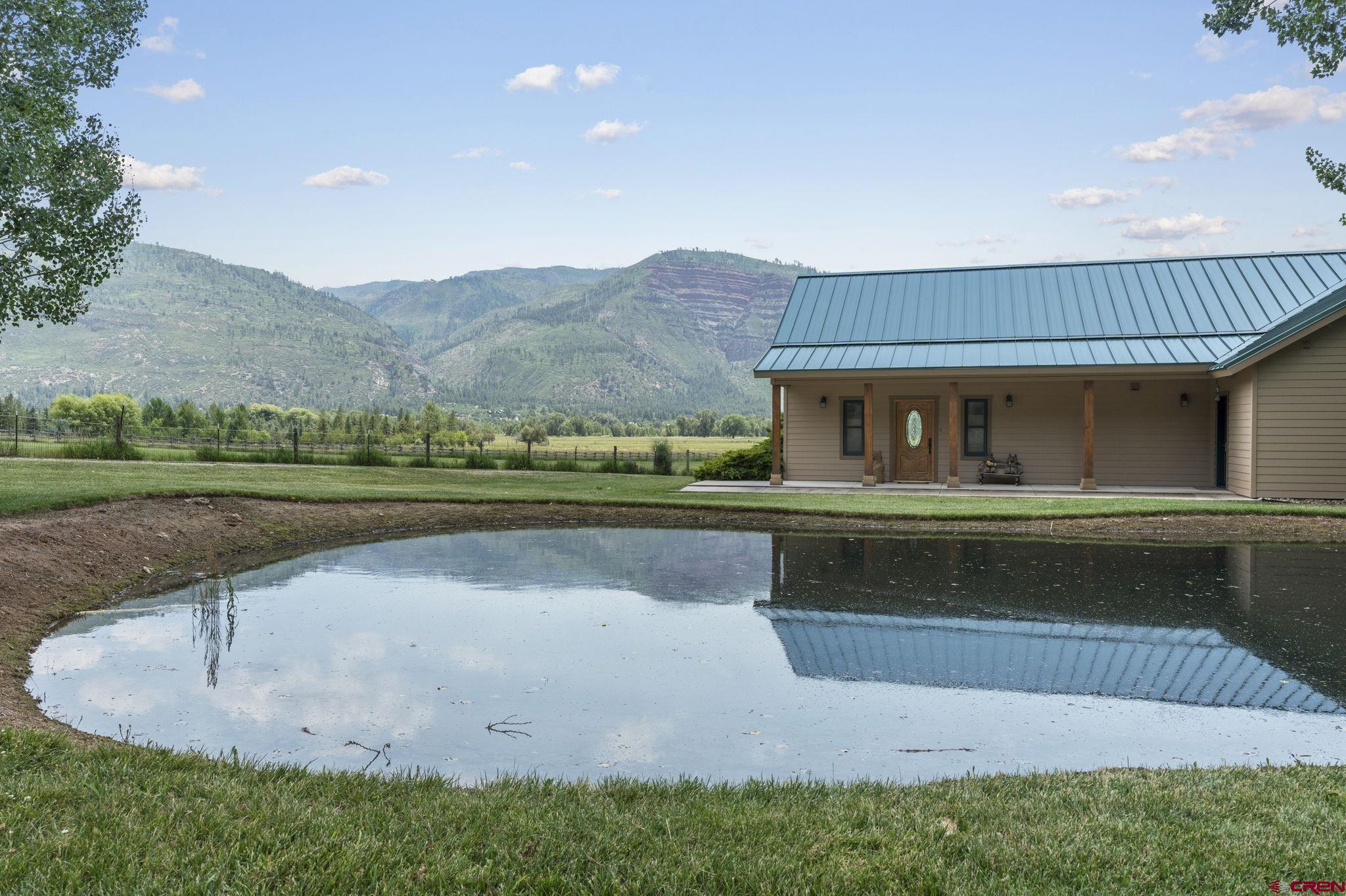 33140 Highway 550 Durango, CO 81301 - Photo 7 of 38 a view of house with outdoor space and swimming pool